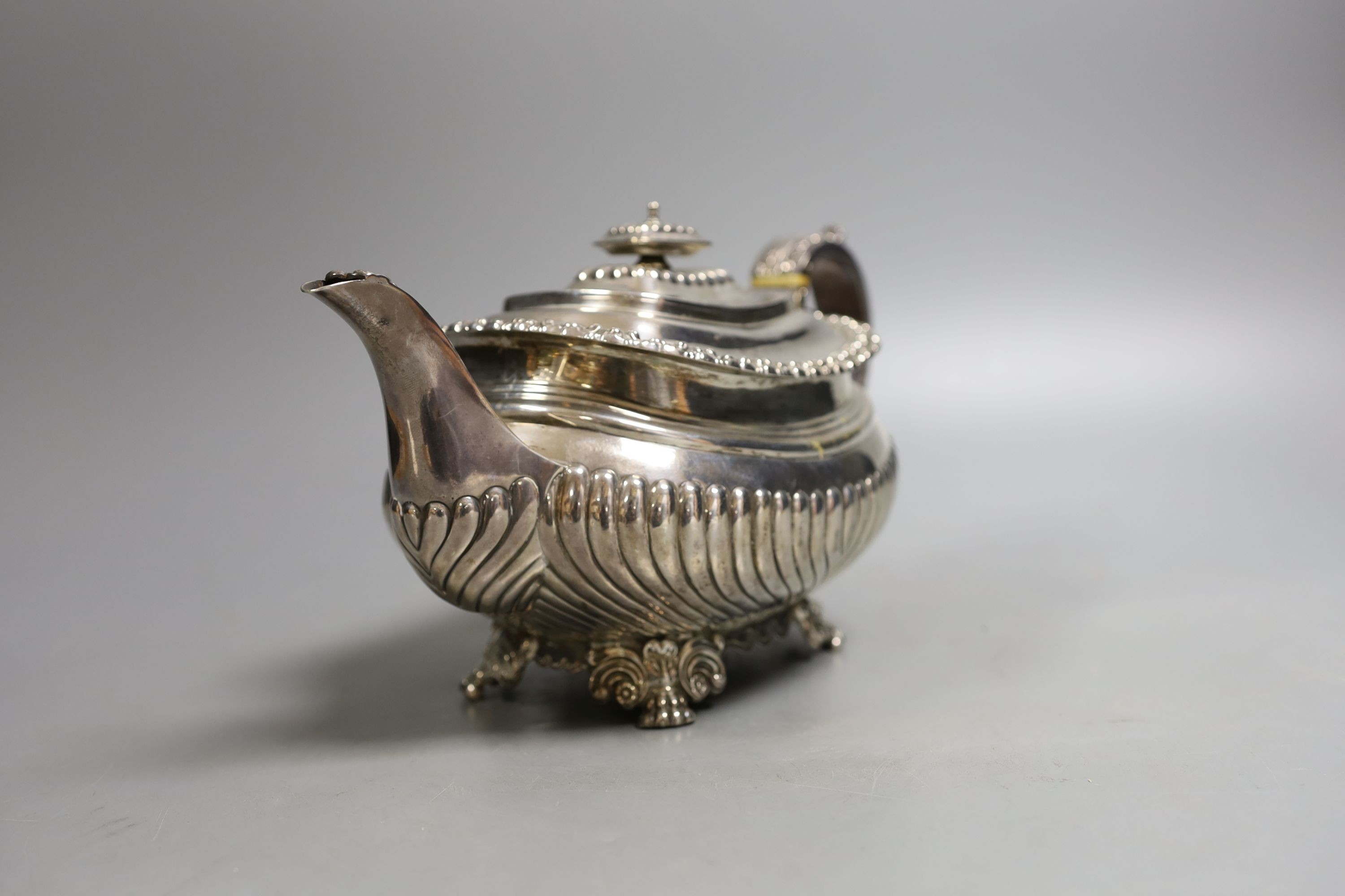 A George IV demi-fluted silver teapot, by John & Thomas Settle, Sheffield, 1824, gross weight 23.5oz (patch to base).